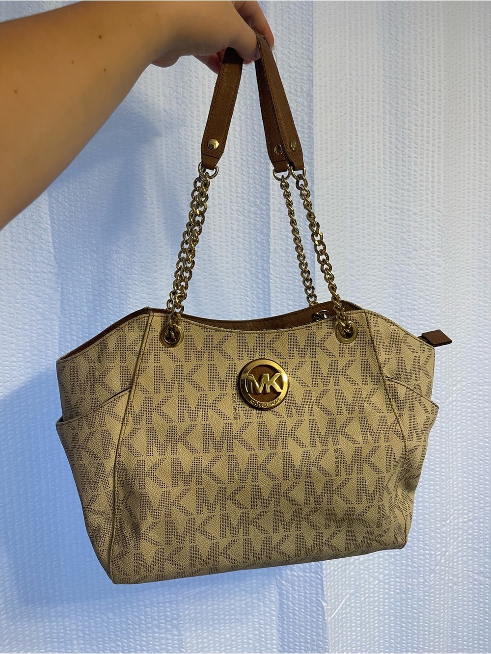 39. Rehab, Michael Kors purse.